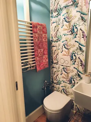 a bathroom with a toilet and a sink at Elegant apartment 5 minutes from the subway in Rome