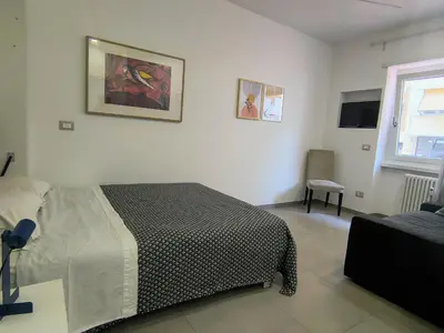 a bedroom with a bed and a window at Casa di Eu - WelcomeToRhome in Rome