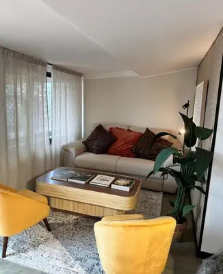 a living room with a couch and a coffee table at Da Brando Loft PONTE MILVIO in Rome