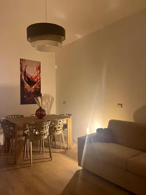 a living room with a couch and a table at Imera House City Retreat in Rome