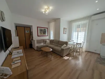 a living room with a couch and a table at Vatican Family Apartment in Rome