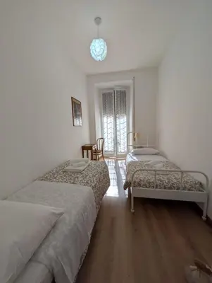 a bathroom with a toilet and a sink at Vatican Family Apartment in Rome