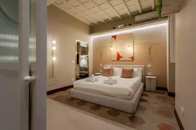 a bedroom with a large bed in a room at Monti Charme in Rome