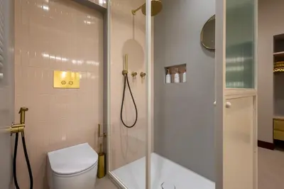 a bathroom with a shower and a toilet and a shower at Monti Charme in Rome