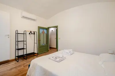 a room with a bed with two towels on it at Colosseo Comfort e Stile in centro a Roma in Rome