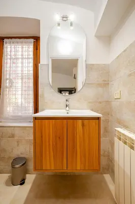 a bathroom with a sink and a mirror at Colosseo Comfort e Stile in centro a Roma in Rome
