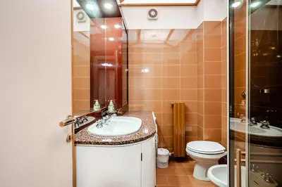 a bathroom with a sink and a toilet at Eleganza e charme a due passi da Piazza di Spagna in Rome