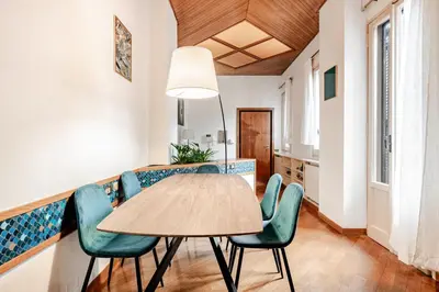 a dining room with a table and chairs at Eleganza e charme a due passi da Piazza di Spagna in Rome