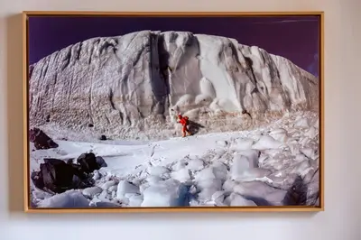 a person standing on top of a snow covered mountain at Elegantis Gallo Suite Apartment - Few steps from the Vatican in Rome