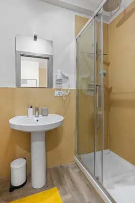 a bathroom with a sink and a shower at Conca D'Oro Guest House - Stefania in Rome