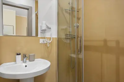 a bathroom with a sink and a shower at Conca D'Oro Guest House - Stefania in Rome