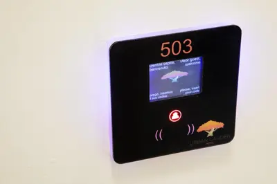 a digital clock on a wall with the time at Urban Garden Suites in Rome