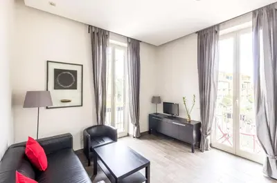 a living room with a couch and a table at Panorama Home in Rome