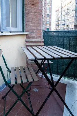 a picnic table and a bench on a balcony at Moderno e centrale, a 2 min dalla metro B in Rome