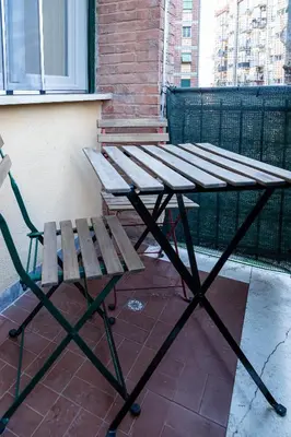 a picnic table and a bench on a balcony at Moderno e centrale, a 2 min dalla metro B in Rome