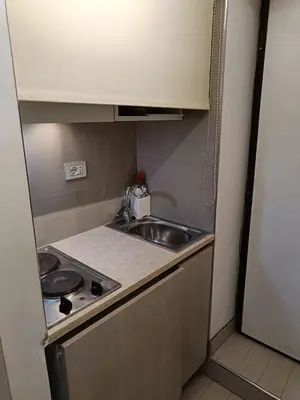 a small kitchen with a sink and a stove at Domus Pantheon in Rome