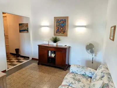 a living room with a couch and a table at Flaminio Charme in Rome