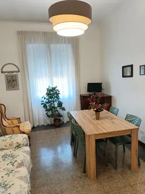 a living room with a table and a couch at Flaminio Charme in Rome