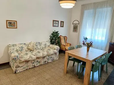 a living room with a couch and a table at Flaminio Charme in Rome