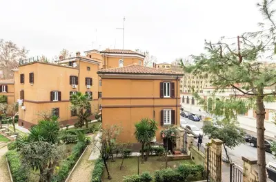 a view of a building with trees and a street at St John Home in Rome