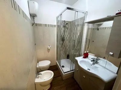 a bathroom with a toilet and a sink and a shower at Dream Forest in Rome