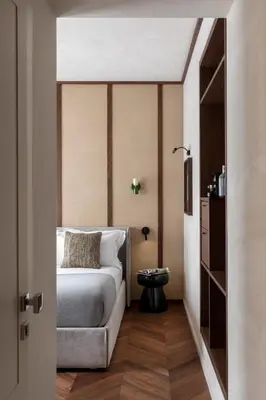 a bedroom with a bed and a table in a room at NAMAN HOTELLERIE - Roma in Rome