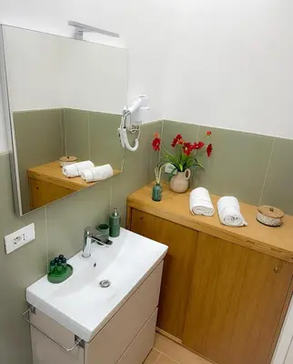 two beds sitting next to each other in a room at Accommodation in Rome near Termini Loft San Lorenzo in Rome
