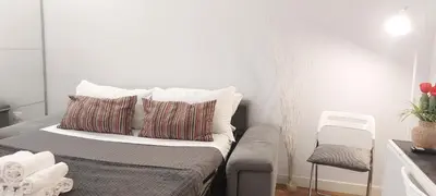 a bed with two pillows on it in a room at Navona Cozy Apartment in Rome