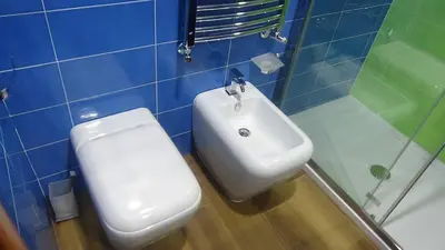 a bathroom with a white toilet and a sink at Bed and Breakfast Adduci's House in Rome