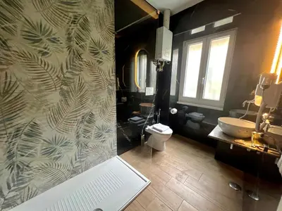 a bathroom with a toilet and a sink at Qg Golden Rooms in Rome