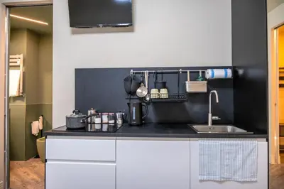 a kitchen with a sink and a counter top at zampieri house camera verde in Rome