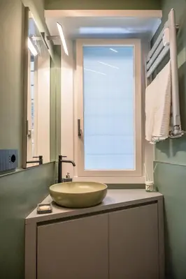 a bathroom with a large bowl sink on a counter at zampieri house camera verde in Rome
