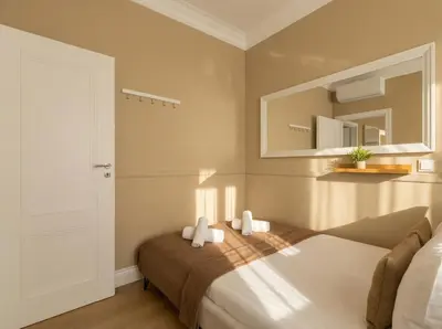 a bedroom with a bed and a mirror at ROME City Center Apartment IV in Rome
