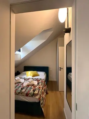 a bedroom with a bed in a attic at Renewed Historic Flat in Rome in Rome