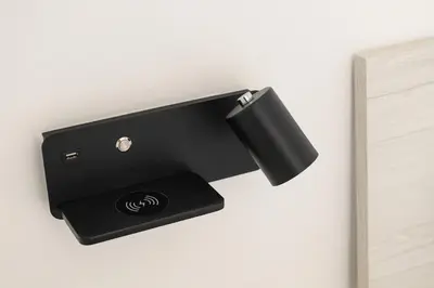 a black wall mounted wall light with a black holder at Lovely apartment in the City Centre in Rome