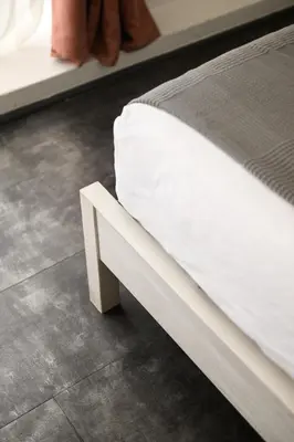 a close up of a bed with white sheets at Lovely apartment in the City Centre in Rome