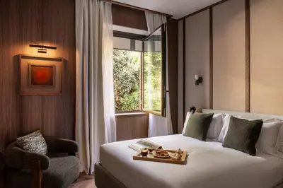 a hotel room with a bed and a window at NAMAN HOTELLERIE - Condotti in Rome