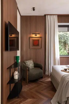 a hotel room with a bed and a chair at NAMAN HOTELLERIE - Condotti in Rome