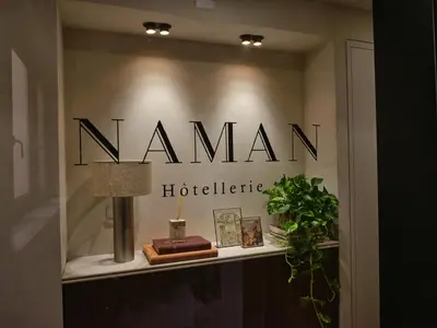 a sign for a namemia hospital on a shelf at NAMAN HOTELLERIE - Condotti in Rome