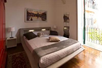a bedroom with a bed in a room with a window at Roma San Peter Suite in Rome