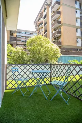 a table and two chairs sitting on a balcony at zampieri house camera blu in Rome