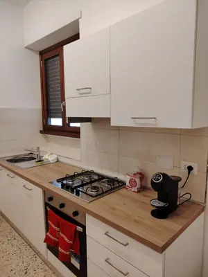 a kitchen counter with a stove and a sink at Anna Roma House 2 in Rome