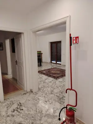 a room with a marble floor and a fire hydrant at Anna Roma House 2 in Rome