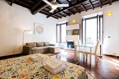 a living room with a couch and a table at Persia Collection Ripetta in Rome