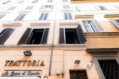 a building with a sign on the side of it at Persia Collection Ripetta in Rome