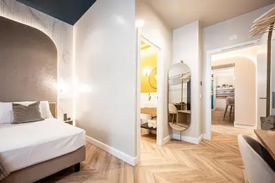a bedroom with a bed and a desk in a room at Bea Boutique Hotel in Rome