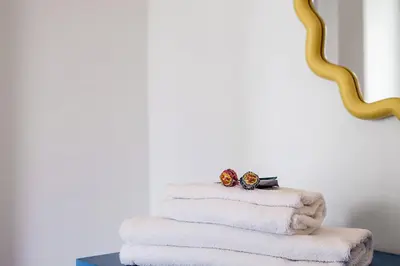 a stack of towels with two engagement rings on them at Lungotevere Bijou with Private Balcony in Rome