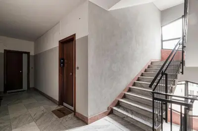an empty hallway with stairs and a door at Lungotevere Bijou with Private Balcony in Rome