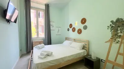 a bedroom with a bed with towels on it at La casa dell'artista in Rome