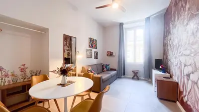 a living room with a table and a couch at La casa dell'artista in Rome